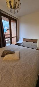 a bedroom with a bed with a towel on it at Edelweiss 2100 in Tignes