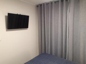 TV o dispositivi per l'intrattenimento presso Tranquilo y Acogedor departamento en Con Con