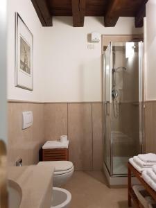 a bathroom with a shower and a toilet and a sink at Al Melograno - Room & Breakfast in Bologna
