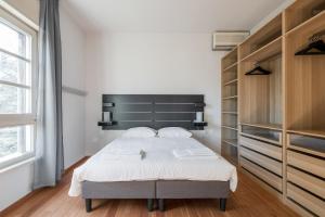 Postel nebo postele na pokoji v ubytování Tagliacozzi Suite Apartment