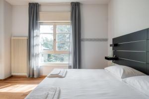 Postel nebo postele na pokoji v ubytování Tagliacozzi Suite Apartment