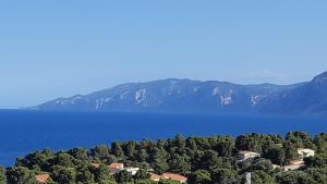 arial view of a lake with mountains in the background at Appartamento Orticello in Cala Gonone