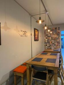 a room with a wooden table and two chairs at HOSTEL CUARTO in Sao Paulo