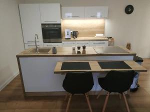 Kuchyňa alebo kuchynka v ubytovaní Slnečný apartmánový dom Oslany