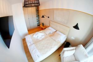 Postel nebo postele na pokoji v ubytování Apartments AQUA & SPA