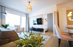 TV a/nebo společenská místnost v ubytování Apartments AQUA & SPA