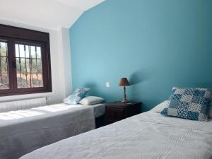 Postel nebo postele na pokoji v ubytování Casa Paco de Gredos
