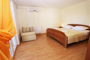 Ein Bett oder Betten in einem Zimmer der Unterkunft Apartments Marin