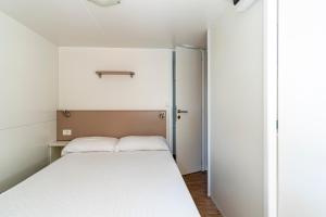 Ein Bett oder Betten in einem Zimmer der Unterkunft Camping Daino