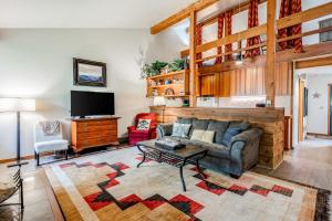 a living room with a couch and a tv at Lake Creek 1323 in Wilson