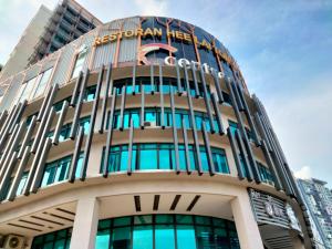 a building with the austonian hotel on top of it at CentreStage PJ by HomeBrickz in Petaling Jaya