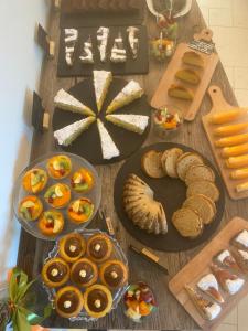 a table topped with lots of different types of bread at Alla Riva in Verona