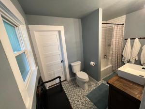 a bathroom with a toilet and a sink and a shower at Downtown Williams, walk everywhere, remodeled in Williams