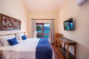Sjónvarps- og/eða afþreyingartæki á Barra do Piuva Porto Hotel