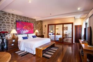 Rúm í herbergi á Barra do Piuva Porto Hotel