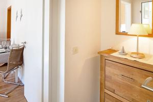 a bathroom with a sink and a mirror and a table at Hygge in List +17 photos