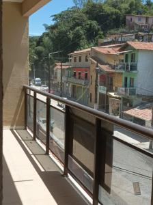 a balcony with a view of a city at Temporada Serrana in Guaramiranga