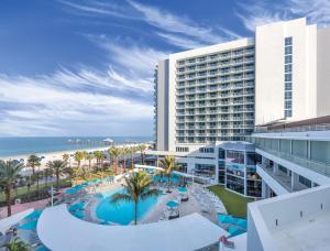 an aerial view of a hotel with a pool and the beach at Club Wyndham Clearwater Beach Resort in Clearwater Beach