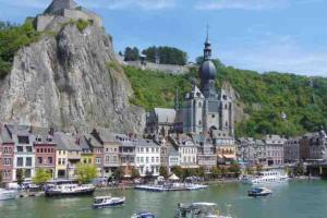 a town on a river with boats in the water at Albert 20 Brussels-charleroi-airport in Charleroi