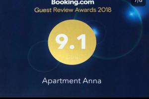 a poster for a guest review awards with a yellow circle at Ann Appartment in Tbilisi City