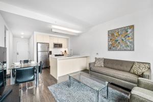 a living room with a couch and a table at Global Luxury Suites at Reston Town Center in Reston