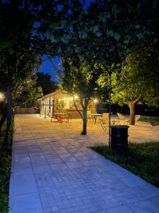 a walkway in a park at night at Villa Number 6 in Skopje