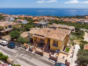an aerial view of a house with the ocean at casa anna in Cala Gonone