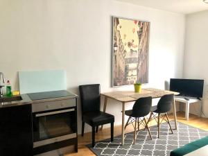 a dining room with a table and chairs at Scandinavian apartments Heart of the city Kamppi 1, 5, 6 in Helsinki
