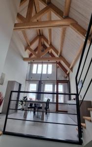 an attic dining room with a table and chairs at Residence Rossella - App 3 in Roeselare