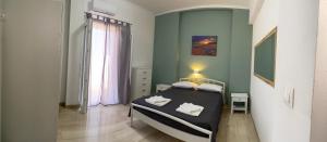 Posteľ alebo postele v izbe v ubytovaní Nikilein's House, διαμέρισμα 150μ απο την παραλία