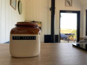 a jar of peanut butter sitting on a table at The Kuhvee in Exeter
