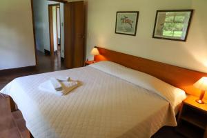מיטה או מיטות בחדר ב-Hotel Fazenda Bela Vista