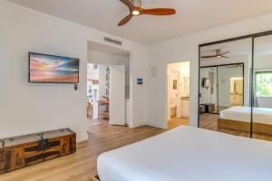 a bedroom with a bed and a ceiling fan at K B M Resorts- KGV-19P2 Beautifully designed two bed two bath Golf Villa with breath taking acqua marine views in the heart of Kapalua in Kapalua