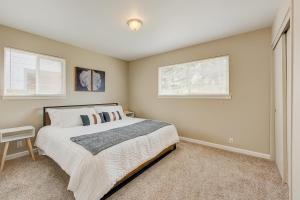 a bedroom with a large bed and two windows at Escape at Edgewood in Stateline