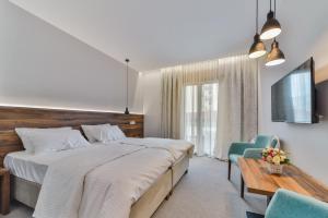 Voodi või voodid majutusasutuse Hotel Vladimir toas