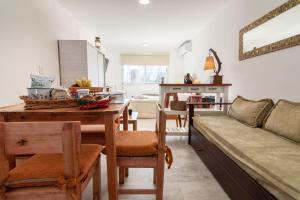 a living room with a couch and a table at Asturiano 5 Miramar in Miramar