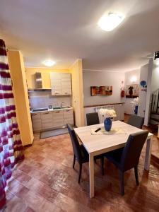 a kitchen and dining room with a table and chairs at Antica Locanda Zio Cesare MONTELEPRE in Montelepre