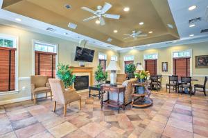 a living room with chairs and a fireplace at Elkridge Townhome about 15 Mi to Dtwn Baltimore! in Elkridge