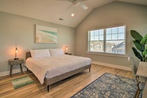 a bedroom with a large bed and a window at Gorgeous Newly Built Home Golf Course View! in Brigantine