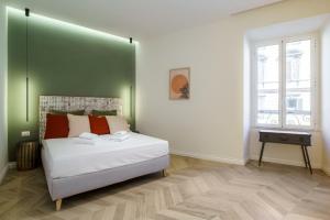 A bed or beds in a room at La Dolce Vita Ottaviano