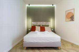 A bed or beds in a room at La Dolce Vita Ottaviano