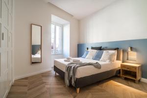 A bed or beds in a room at La Dolce Vita Ottaviano
