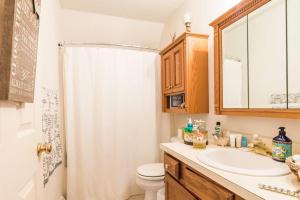 a bathroom with a sink and a toilet and a shower at Luba's Peaceful Bedroom in Parma +44 photos