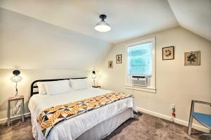 Un dormitorio con una cama grande y una ventana en Pet-Friendly Saranac Lake Retreat with Deck and Yard, en Saranac Lake