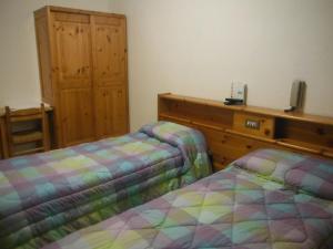 Postel nebo postele na pokoji v ubytování Hotel Mochettaz