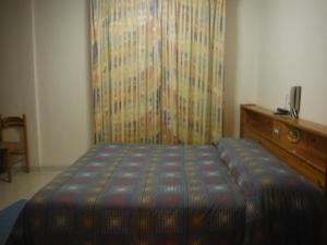 Postel nebo postele na pokoji v ubytování Hotel Mochettaz