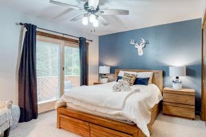 a bedroom with a bed and a ceiling fan at Big Boulder Bliss in Lake Harmony +61 photos