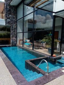 a swimming pool in the middle of a house at Casa Nicolás in Valle de Bravo
