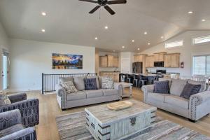 a large living room with couches and a kitchen at Garden City Retreat with Access to Bear Lake! in Garden City
