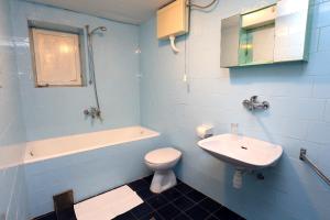 a blue bathroom with a toilet and a sink at Rooms by the sea Racisce, Korcula - 3095 in Račišće